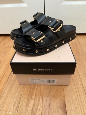 BCBGeneration Black Slide Sandals with Gold Hardware
